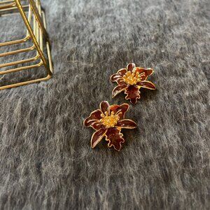 Gold-tone metal and Red resin floral earrings